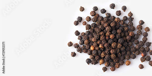 The Close-up Photo of Black Peppercorns with a Focus on Their Textured Surfaces, Scattered Across a White Background. This Photo Could be Used to Showcase Spices in Culinary Articles, etc. photo