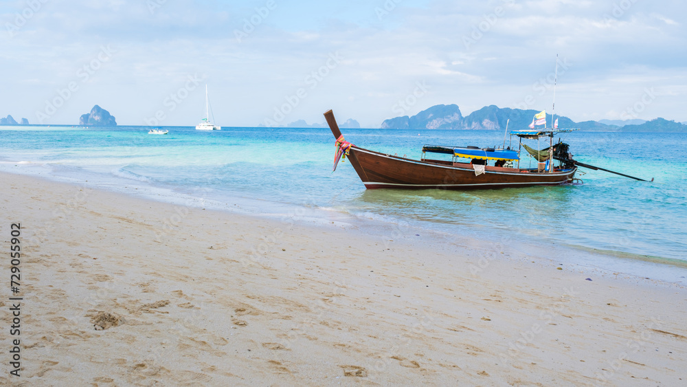 Longtail boat on the tropical beach of Koh Kradan Trang Thailand.