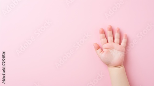 Pink background highlights a child s hand  conveying the significance of children s health.