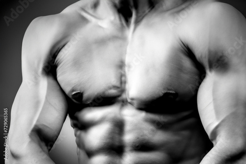 muscular body. male torso with muscles in black and white effect, closeup, sport concept