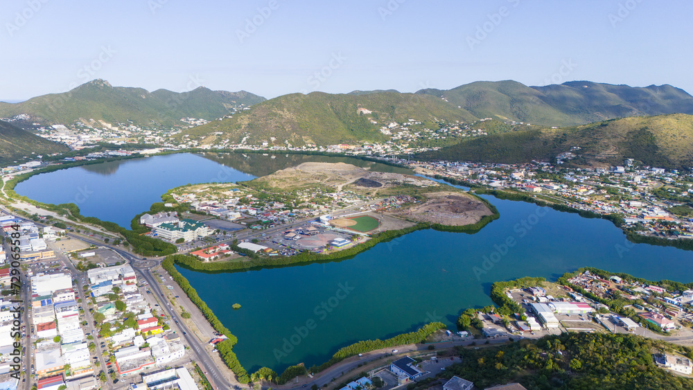 The Caribbean island of St Maarten. St Martin cityscape. Scenic aerial view of the Caribbean. Great salt pond.