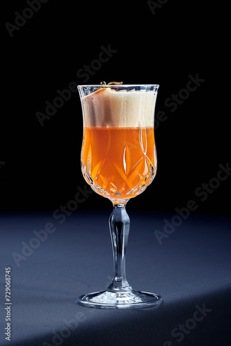 Alcoholic cocktail with star anise and orange