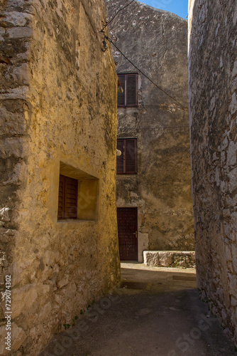 Fototapeta Naklejka Na Ścianę i Meble -  An alley in the Stari Grad historic centre of the coastal town of Novi Vinodolski, Primorje-Gorski Kotar County, Croatia