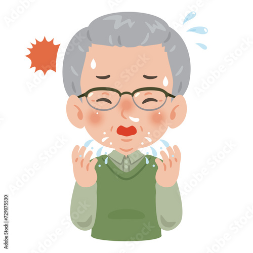 くしゃみをするシニア男性
