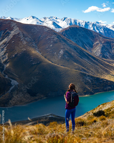 adventurous hiker girl on the way to the top of trig m, scenic peak in new zealand alps, near arthur's pass village and lake lyndon   © Jakub