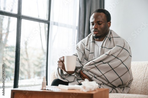 Slika na platnu Terrible flu. Sick black man is at home