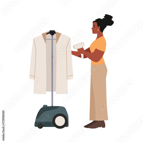 Woman smoothes hanging clothing using steamer flat style