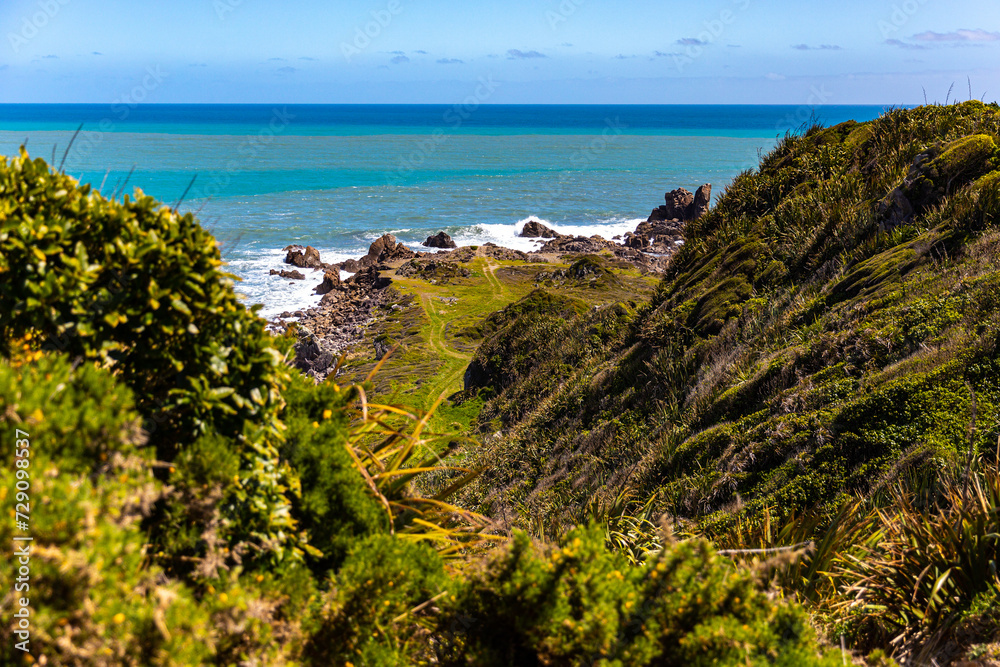unique landscape of cape foulwind on the west coast of new zealand south island; scenic little bays with large cliffs and rocky islands; cape foulwind walkaway near westport unique landscape of cape foulwind on the west coast of new zealand south island; scenic little bays with large cliffs and rocky islands; cape foulwind walkaway near westport