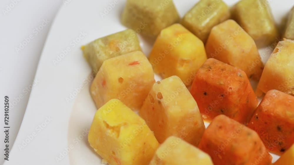 Frozen cubes with crushed sea buckthorn, ginger, lemon and orange for tea. Frozen cubes with crushed sea buckthorn, ginger, lemon and orange for tea.