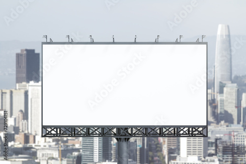 Blank white billboard on cityscape background at daytime, front view. Mock up, advertising concept