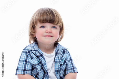 Smiling 2 year old boy with a funny haircut. Child wearing a blue checkered shirt and a white T-shirt. Isolated on a white background. Close-up.