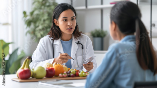 focused female doctor discussing nutrition with a patient  with fresh fruits and vegetables on the table