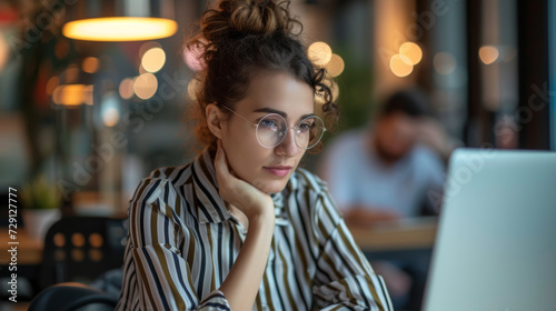 professional woman is sitting with a laptop © MP Studio