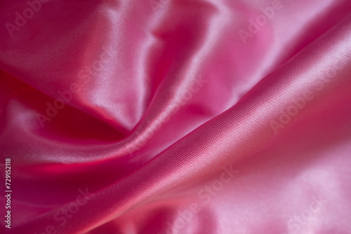 Folded smooth cold pink satin polyester fabric