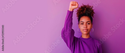 woman raising  fist  for international women's day and the feminist movement. March 8 for feminism, independence, freedom, empowerment, and activism for women rights horizontal background, photo
