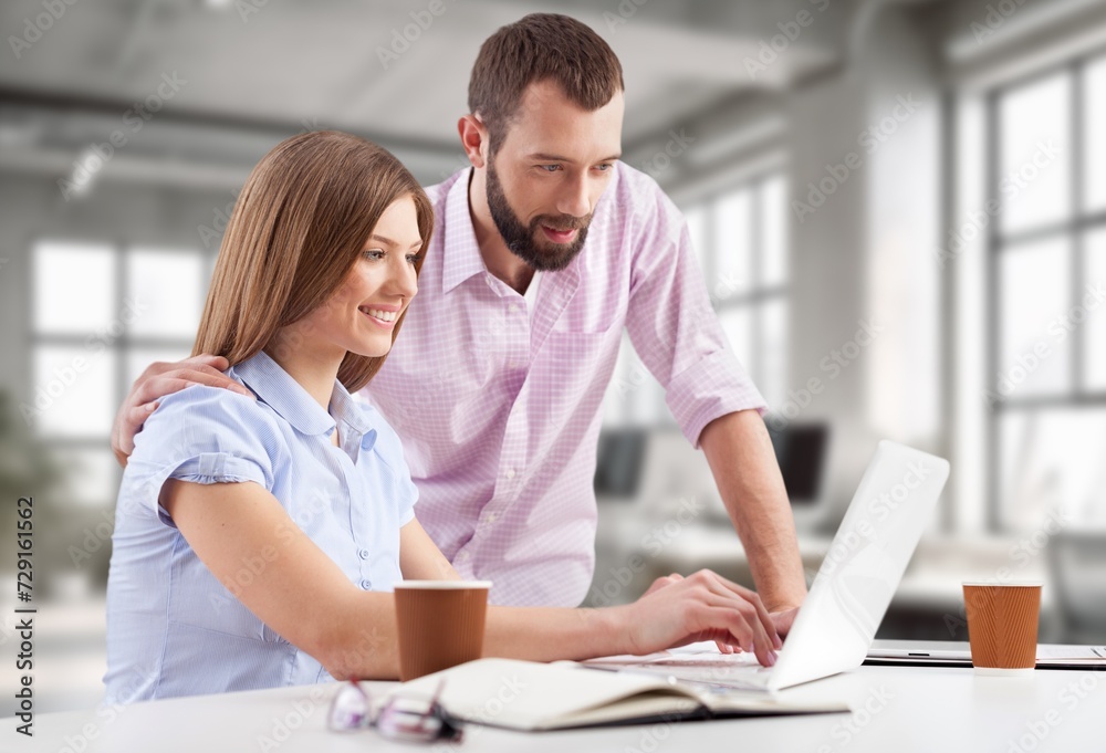 Fototapeta premium Stressful Couple with Laptop Computer in office