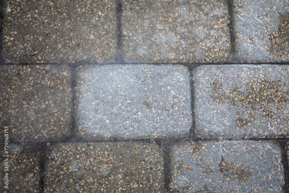 Ice on pavement, slippery sidewalks in winter Ice on pavement, slippery sidewalks in winter