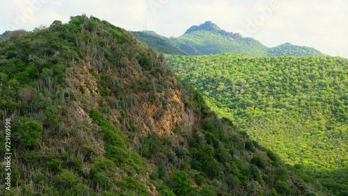 Aerial telephoto reveal of Christoffelberg mountain hills in Curacao photo