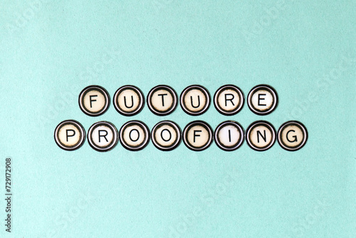 Future Proofing spelt out using vintage fridge magnets over teal green textured paper