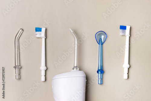 Oral hygiene set Oral teeth irrigator dental floss tongue scraper Beige background Dental care treatments daily routine Horizontal Long Banner