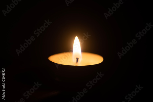 Candle Burning at night dark background