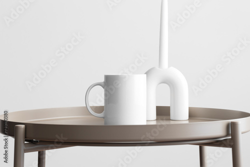White mug mockup with a candle on the beige table.