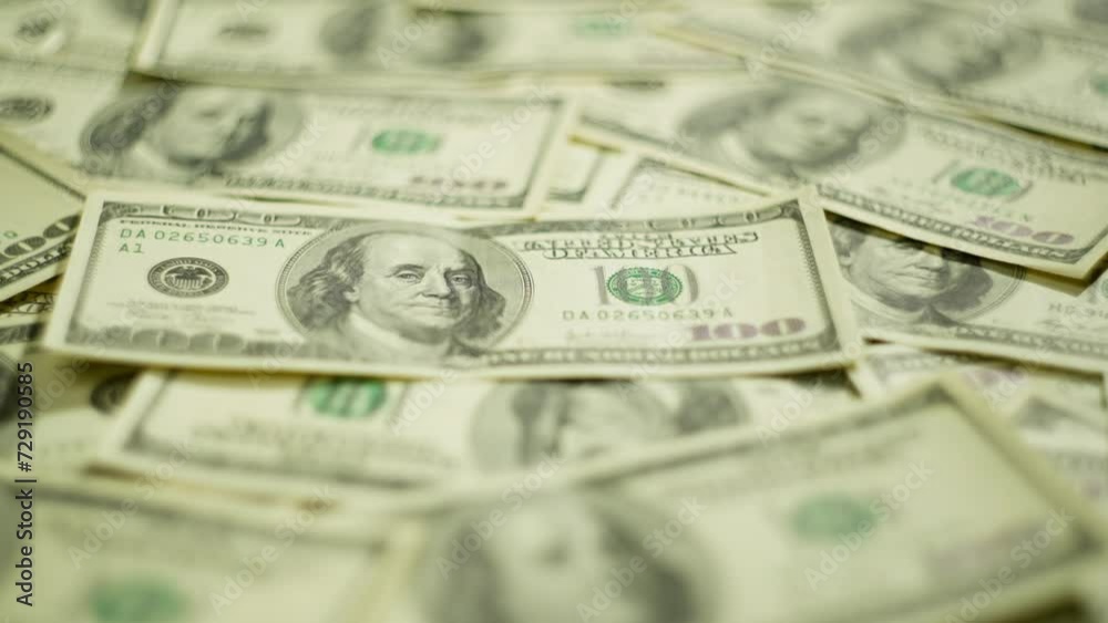 Background video on which one hundred dollar banknotes are spread out. Cash, business, cash settlement, economy. High quality 4k footage Background video on which one hundred dollar banknotes are spread out. Cash, business, cash settlement, economy. High quality 4k footage