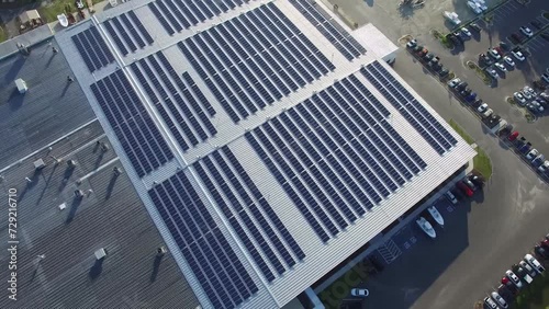 Closeup Of Surface Of Blue Photovoltaic Solar Panels Mounted On Building Roof For Producing Clean Ecological Electricity. Production Of Renewable Energy Concept. photo