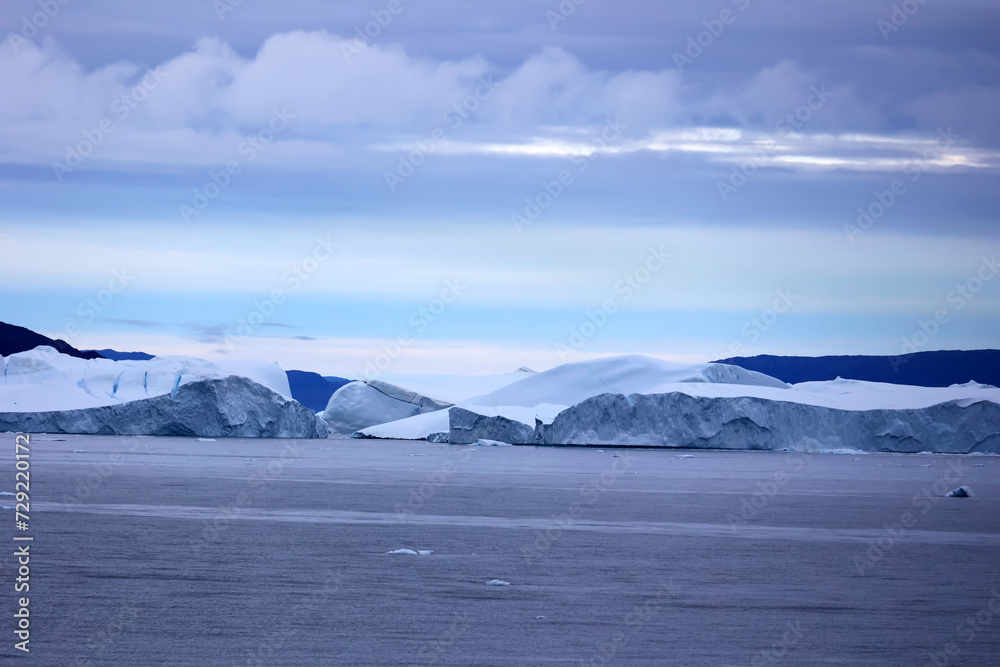 View of iceberg in Ilulissat Icefjord in Disko Bay, Greenland, Denmark View of iceberg in Ilulissat Icefjord in Disko Bay, Greenland, Denmark