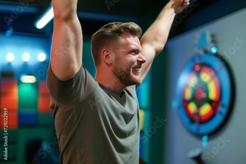 handsome player celebrating a successful bullseye hit