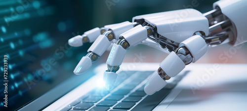 Robot hand using a keyboard on a laptop