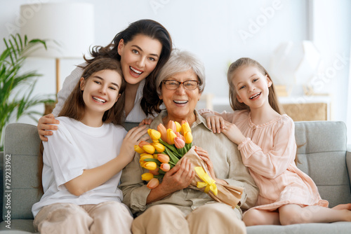 daughters, mom and granny with flowers