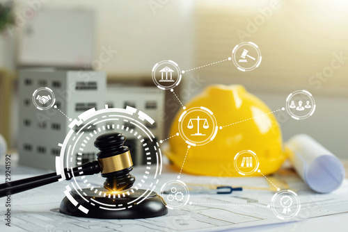 Labor and Construction law concept. judge gavel on building blueprint plans with a yellow safety helmet and building model with law icons. Quality assurance, Guarantee, Standards, ISO certification. photo