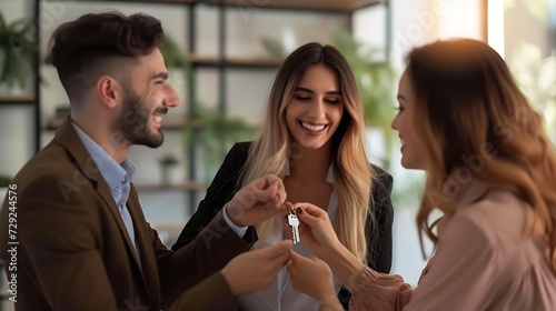 Happy millennial couple receiving keys from realtor, purchasing real estate - Family meeting with real estate agent - New house and real estate concept : Generative AI