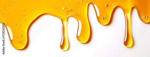 Wallpaper Mural image of golden drops of honey flowing down on a white background; it can be used in food or cosmetic advertising Torontodigital.ca