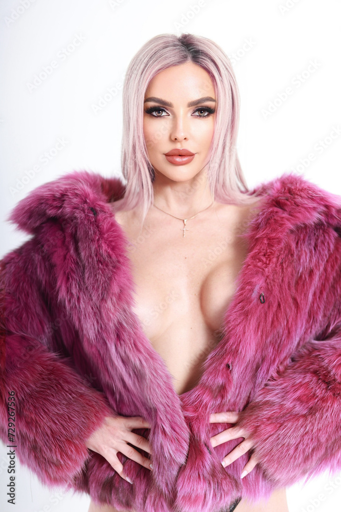 glamorous photo of a girl in lingerie and a bright purple fur coat made of natural fur. background white