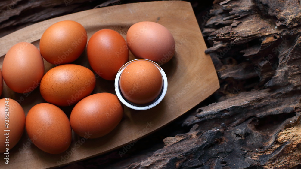 Chicken eggs on a wooden background Chicken eggs on a wooden background
