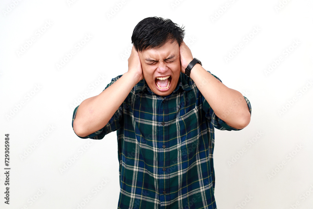 Frustrated young asian man, angry and hands holding head from stress or anxiety isolated on white background Frustrated young asian man, angry and hands holding head from stress or anxiety isolated on white background