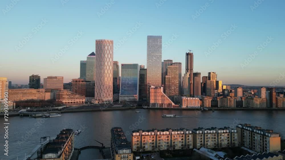 18 January 2024, Canary Wharf, London, UK : Aerial drone footage approaching Canary Wharf with river boat 