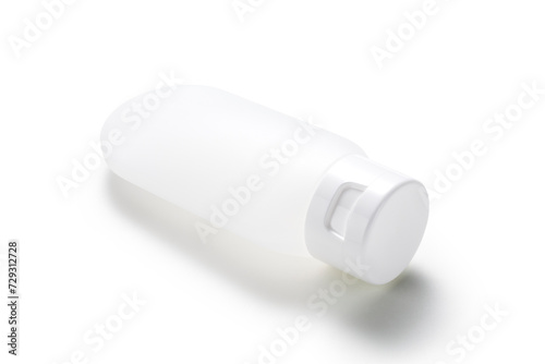 empty cosmetics dispensing bottle on white background
