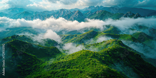 Panoramic view of lush green mountain ranges under a dramatic sky  showcasing the vast beauty of a natural landscape.