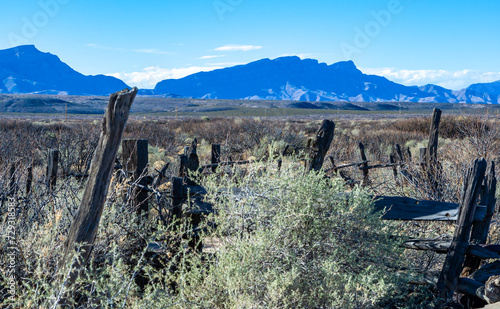 Wooden remains of dwellings and cattle pens in the desert at the bottom of a former dry alkaline lake in White sands National Monument photo