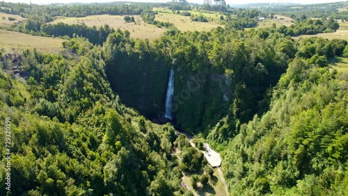 Aerial view circling the Cascadas de Tocoihue waterfall, in sunny Chiloe, Chile photo