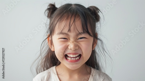 Mischievous Korean Girl with Playful Expression photo