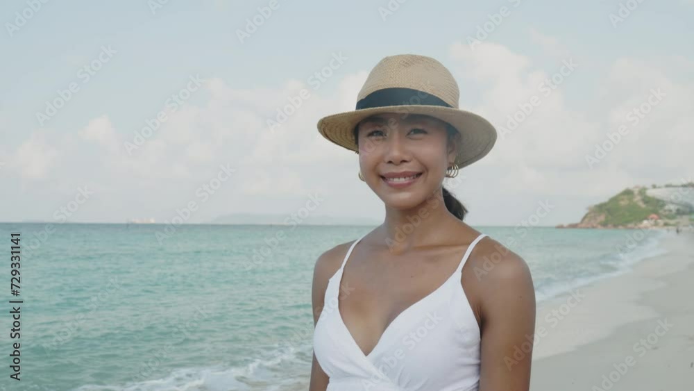 Video portrait, woman walking on the beach on vacation Video portrait, woman walking on the beach on vacation