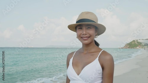 Wallpaper Mural Video portrait, woman walking on the beach on vacation Torontodigital.ca