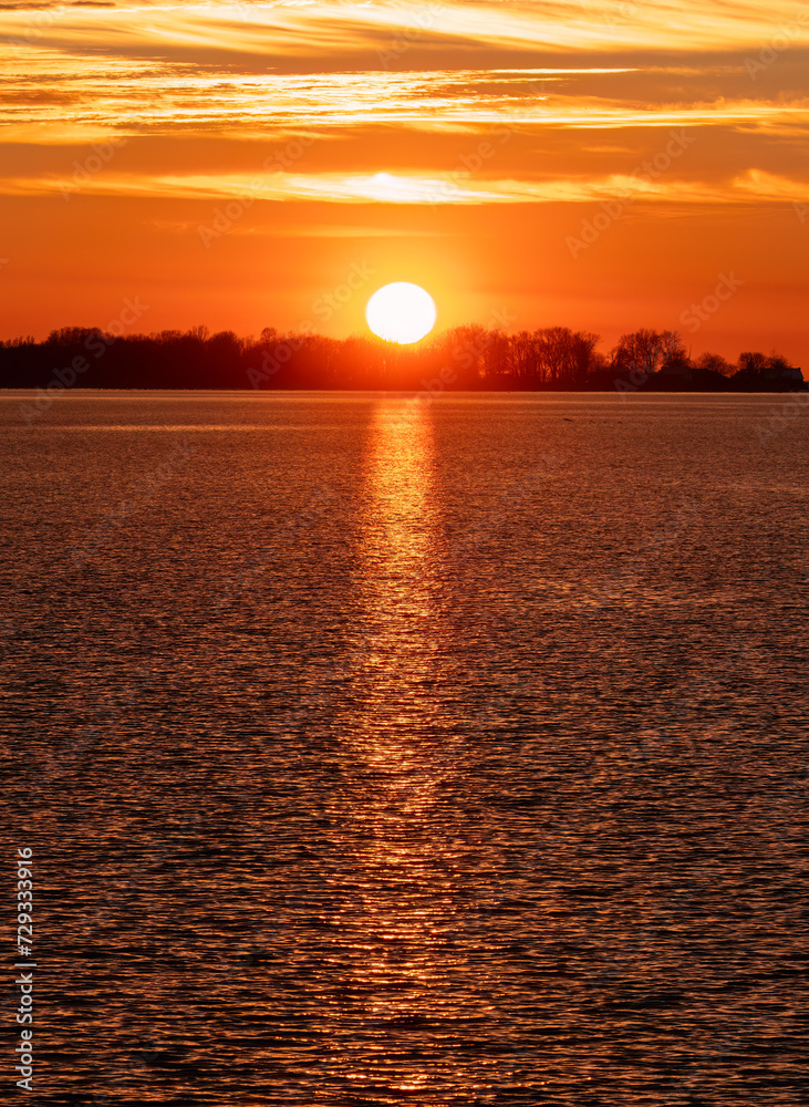 Colours of a sunset in winter over Wolfe Island, Ontario, Canada	