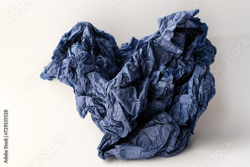 Crumpled craft tissue paper. Texture. Background. Cornflower blue color.