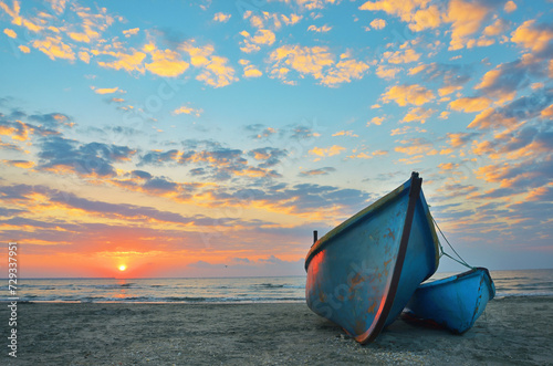 Sunrise at Black Sea over an old fishing boats