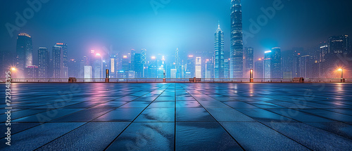 Panoramic view of empty concrete tiles floor near the river with city skyline at night